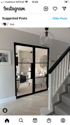 an instagram photo of someone's living room from the stairs in their home