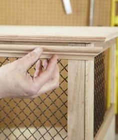 This functional dog crate keeps Fido at bay—and makes a great end table too #DogCrates Diy Dog Kennel Indoor, Dog Kennel Indoor, Diy Dog Crate, Dog Kennel Cover, Dog Crate Cover, Dog Kennel Furniture, Diy Dog Kennel, Crate Ideas, Crate Cover