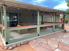 a house with a covered porch and outdoor seating area