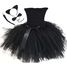 a black cat tutule and headband with a bow on the top, in front of a white background