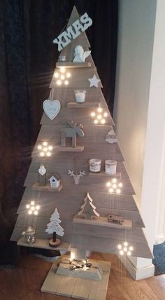 a christmas tree made out of wood with lights