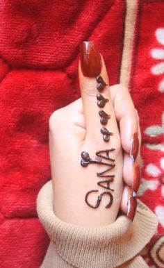 a woman's hand with writing on it that says stay calm in black ink