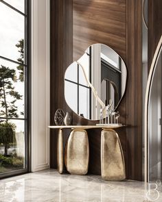 a large mirror sitting on top of a table next to a wall mounted vanity in front of a window