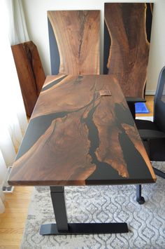 a wooden table sitting on top of a carpeted floor