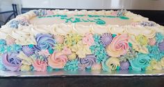 there is a cake that has been decorated with flowers on the top and bottom layer