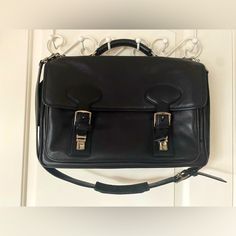 This Buttery Soft Black Coach Messenger Bag Is In Near Perfect Condition. The Only Bit Of Wear Is On A Couple Of The Bottom Corners. On The Inside Center, There Is One Large Padded Zippered Compartment For A Computer That Is 2 1/2 Inches Wide. In Front Of That, Behind The Buckle And Snap Enclosures, There Is An Open Compartment With Three Slip Pockets And Three Pen Pockets. On The Back Side Of The Bag, There Is One Large Open Pocket That Contains Three Slip Pockets And One Zippered Compartment. Measures: Length - 17” Width - 11” Depth 5” Stored In A Smoke-Free Home. Designer Business Bags With Adjustable Strap, Designer Bags With Adjustable Strap For Business, Designer Office Satchel Bags, Designer Rectangular Briefcase With Adjustable Strap, Designer Business Satchel Shoulder Bag, Designer Office Briefcase Shoulder Bag, Designer Black Briefcase With Removable Pouch, Designer Business Satchel With Top Carry Handle, Designer Satchel With Top Carry Handle For Business