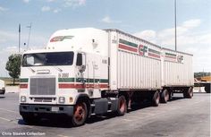 a large white truck parked in a parking lot