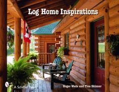 the front porch of a log home with two chairs and an american flag on it