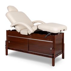 The Sanctuary Adjustable Deluxe Massage Table features height adjustment, closed storage with sliding cabinet doors, and pneumatic lift controlled back and leg rest. Constructed with European Beech wood stained in Cherry, this super comfortable stationary, this super comfortable adjustable table has a 3" thick multi-layered cushion and durable vinyl upholstery. Other features include rounded corners, double leg-lock knobs, and headrest outlets on both ends. Massage Beds, Sliding Cabinet, Spray Tan Business, Sliding Cabinet Doors, Massage Bed, Massage Tables, Cherry Cabinets, Leg Rest, Massage Table