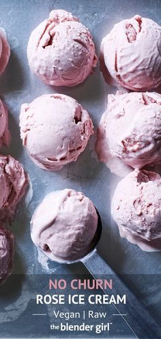 there are many ice creams on the table and one has pink icing in it