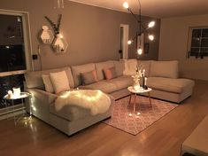 a living room filled with furniture and lights