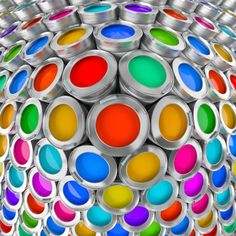 an image of colorful paint cans stacked on top of each other in the shape of a ball