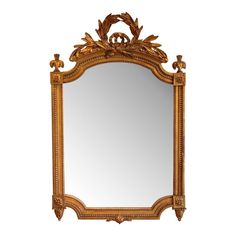 an ornate gold framed mirror against a white background