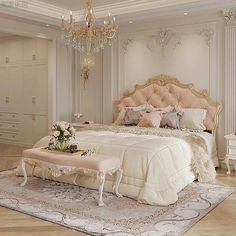 a large bed sitting in a bedroom next to a chandelier