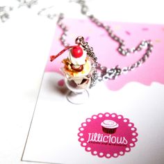 This necklace features a handmade ice cream sundae pendant. The pendant measures about  2.5 cm tall and is attached to a silver tone chain necklace that measures 24 inches in length. Y2k Food, Cream Necklace, Handmade Ice Cream, Food Necklace, Miniature Food Jewelry, Food Charms, Food Accessories, Food Jewelry, Ice Cream Sundae