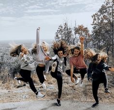 a group of young women jumping in the air