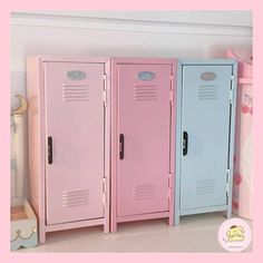 three pink and blue lockers sitting next to each other in a room with white walls