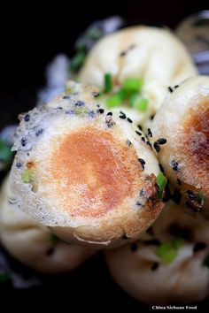 some kind of food that is on top of broccoli and other things in the background