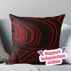 a red and black abstract design with the words support independent artists on it throw pillow