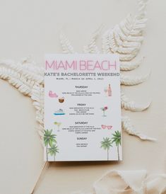 a menu for a miami beach wedding with palm trees and pink flowers on the side