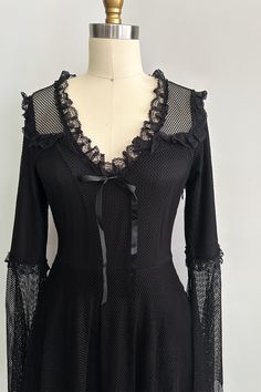 This wickedly wonderful gothic lolita dress is ideal for flaunting all your spooky season coven vibes! Featuring a fishnet long sleeve silhouette with pretty lace trim, a v-neckline, flared sleeves, and an underlining. Scrumptious and spooky? Yes, please! • Sheer outer layer• The fabric has good stretch• Mini length (hits approximately low/mid thigh)• The body is fully lined• Handkerchief hemline on outer layer, with frill trim• Invisible zipper on left side when worn• U-neckline with frill trim Gothic Outfit Ideas, Dark Cottagecore Fashion, Goth Closet, Glamour Goth, Fishnet Long Sleeve, Goth Things, Goth Princess, Moodboard Inspiration, Witch Vibes