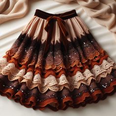 there is a brown and white skirt with sequins on it