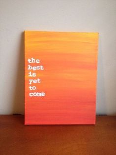 the best is yet to come painted on an orange and pink canvas with white lettering