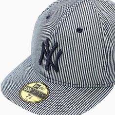 the new york yankees hat is shown in blue and white checkered fabric with a gold emblem