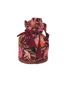 Complete your traditional looks with this lovely potli bag on your wrist, which is trendy yet compact enough to carry your essentials in style. This potli bag will be a pretty inclusion in your accessory collection and perfect for taking in a party. This bag can also be used as a wedding favour bag. It is perfect as a gift for weddings, bridal showers, baby showers, and wedding receptions - excellent to fill with candy, dry fruits, sweets, herbs, soap, or something remarkable for your guests that no one will leave behind! Product Details - Condition Brand New - Product: Potli Bag with Drawstrings for closure - Fabric: Fine Velvet - Embroidery: Kashmiri Aari Jaal Work - Colour: Maroon - Size: 7″ High and 5″ Base (18 cms High and 13 cms Base) approx. - Product Care: Dry Clean Only If you wan Gift Bucket Bag With Dust Bag, Multicolor Bucket Bag With Removable Pouch As Gift, Bucket Box Bag With Removable Pouch As Gift, Bucket Shoulder Bag With Dust Bag As Gift, Gift Bucket Box Bag With Removable Pouch, Festive Red Embroidered Bag, Traditional Clutch Bag With Removable Pouch, Red Embroidered Handheld Bag, Festive Embroidered Pouch Bag