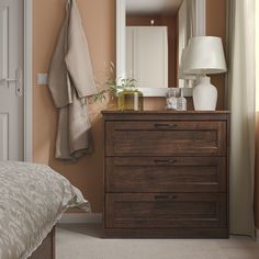 a bedroom scene with focus on the dresser