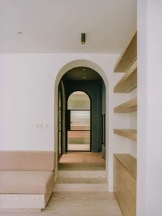 the hallway is empty and has no one in it or there are bookshelves on either side