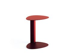 a red table with a round top on an isolated white background for use in interior design