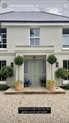 a white house with potted plants in front of it and the words, enjoy a cooler day but there is no sun