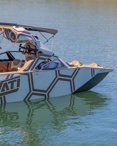 a motor boat with an open cockpit in the water