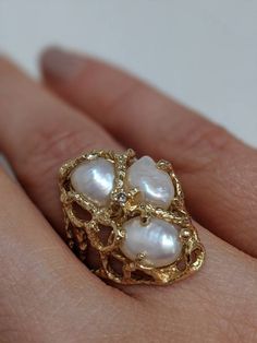 This vintage pearl ring features 3 large fresh water pearls and a small diamond in the center. sz 7 however, this ring can be resized for no additional fee if there is that need. Fresh water pearls measure about 9mm long and about 7mm wide. The whole ring is 1 inch from top to bottom. Luxury Unique Pearl Rings, Luxury Antique Pearl Ring With Diamond, Luxury White Baroque Pearl Rings, Luxury Intricate Design Pearl Ring For Anniversary, Pearl Rings Vintage Pendant, Luxury White Heirloom Pearl Ring, Luxury Antique Cabochon Pearl Ring, Luxury Cluster Pearl Ring As A Gift, Luxury Oval Pearl Ring