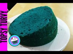 a green cake sitting on top of a white plate