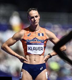 a female athlete is posing for the camera