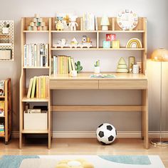 a child's room with bookshelves, desk and soccer ball