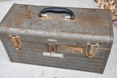 an old suitcase sitting on top of a sidewalk