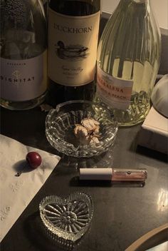 several bottles of wine sitting on top of a table