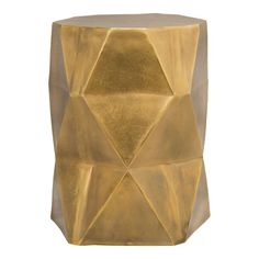 a gold side table with geometric shapes on it