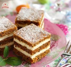 three pieces of cake sitting on top of a pink plate