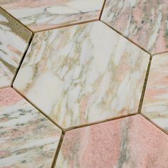 closeup of pink and white marble hexagonal tiles