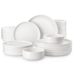 white dishes are stacked on top of each other