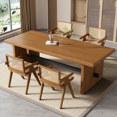 a wooden table with chairs around it and a rug on the floor next to it