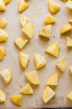 sliced up potatoes on a baking sheet ready to be cooked in the oven for dinner