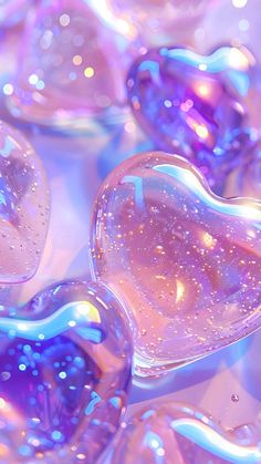 several heart shaped soap bubbles are shown in this close up photo, as if they were floating or floating on top of each other