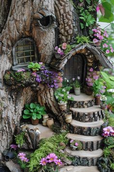 a fairy house made out of tree stumps and flowers