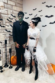 a man and woman dressed up in halloween costumes