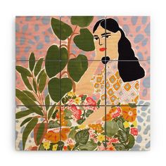 an art work with flowers and leaves on the tile in front of a woman's face